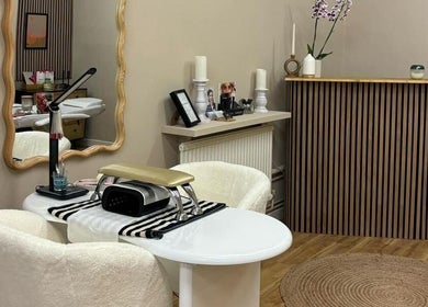 Elegant nail station in The Olive Room Hereford, Hereford, England, GB with cozy chairs and stylish decor.
