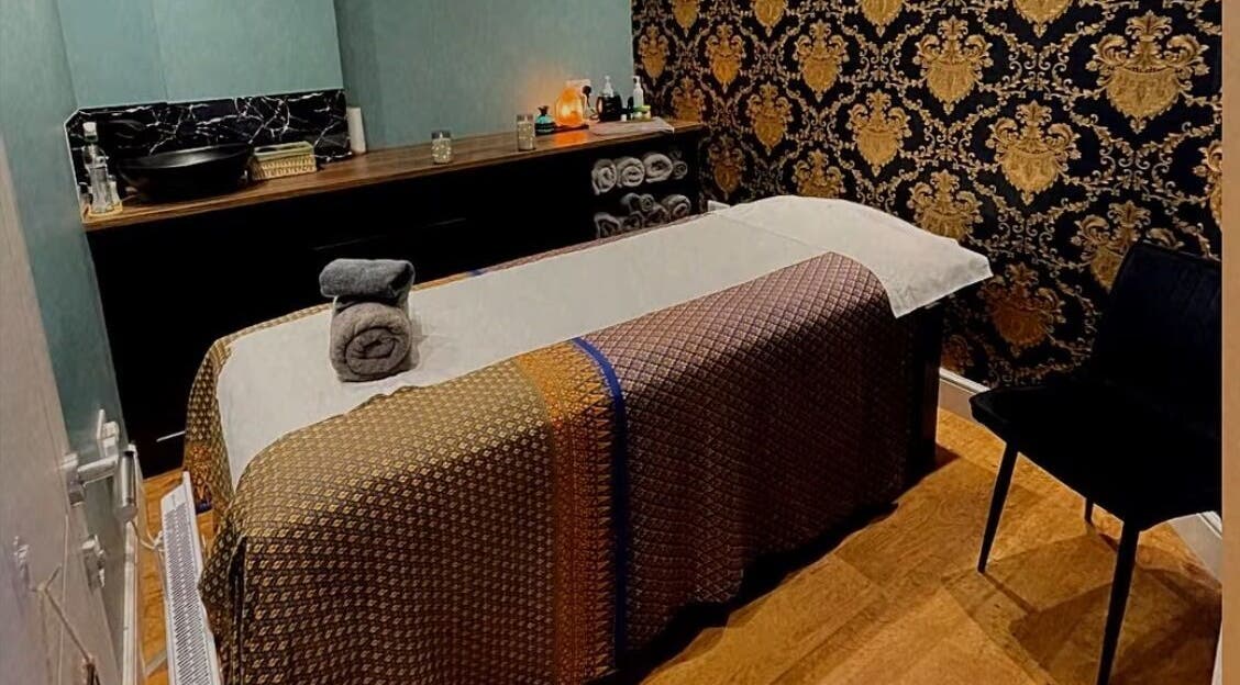 Relaxing massage room at Jariya Thai Massage & Spa, Bagshot, England, GB with elegant decor and cozy ambiance.