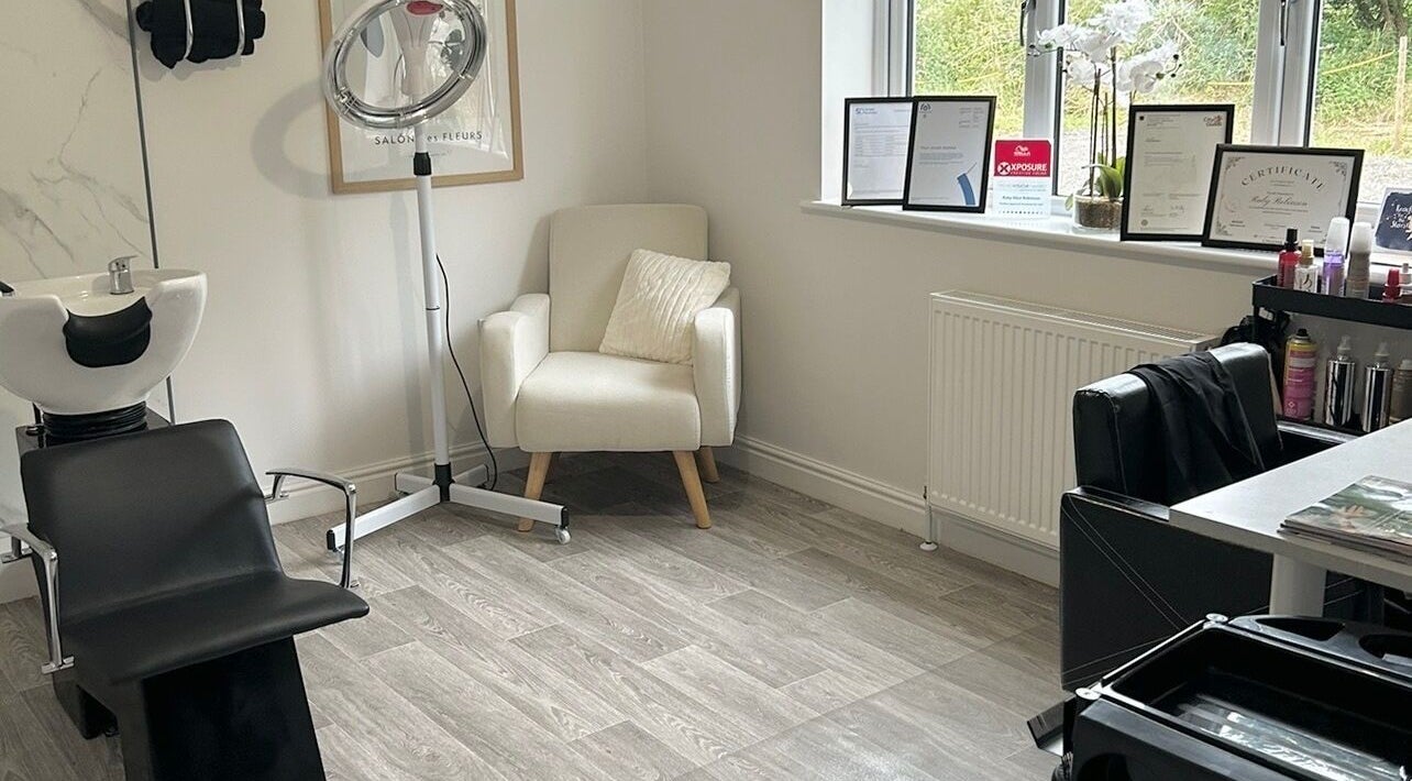 Cozy styling corner at Ruby Alice Hair in Broughton, England, GB featuring sleek salon chair and products.