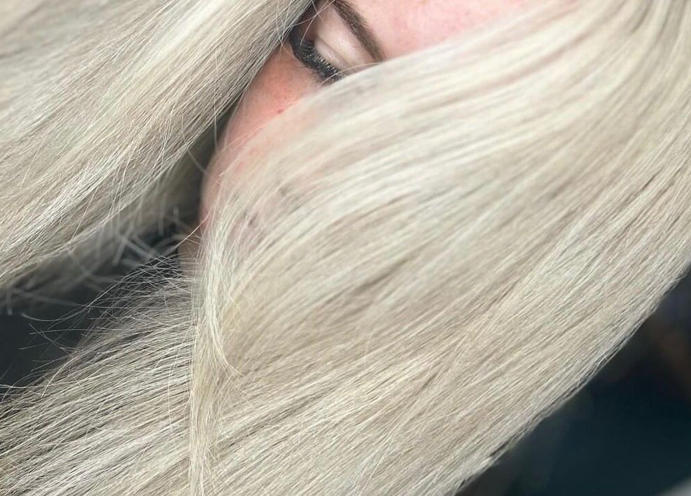 Close-up of sleek blonde hairstyle at Ruby Alice Hair in Broughton, England, GB, showcasing smooth texture.