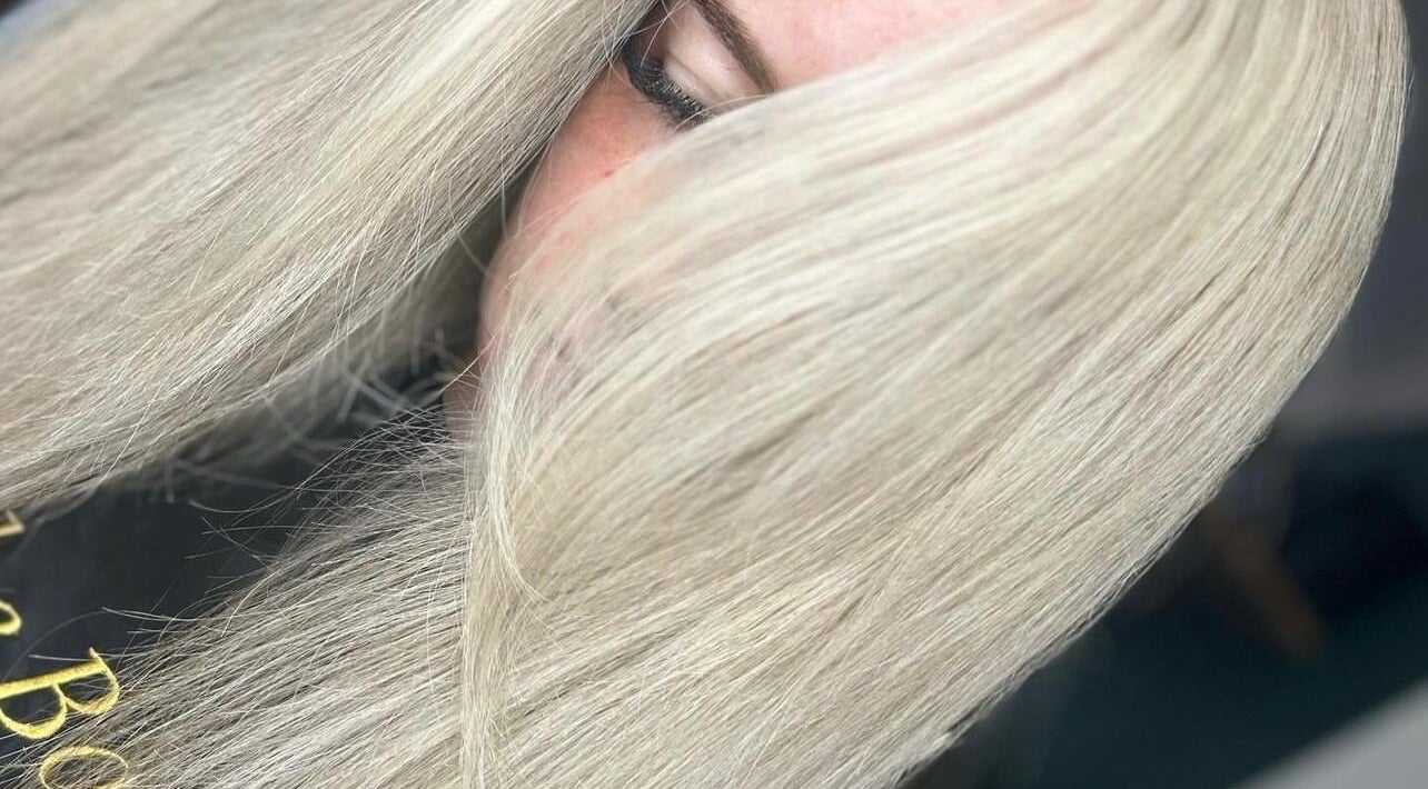 Close-up of sleek blonde hairstyle at Ruby Alice Hair in Broughton, England, GB, showcasing smooth texture.