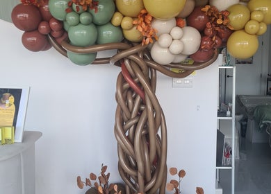 Elegant balloon tree sculpture in Waxing Crescent, Willington, England, GB beauty salon entrance.