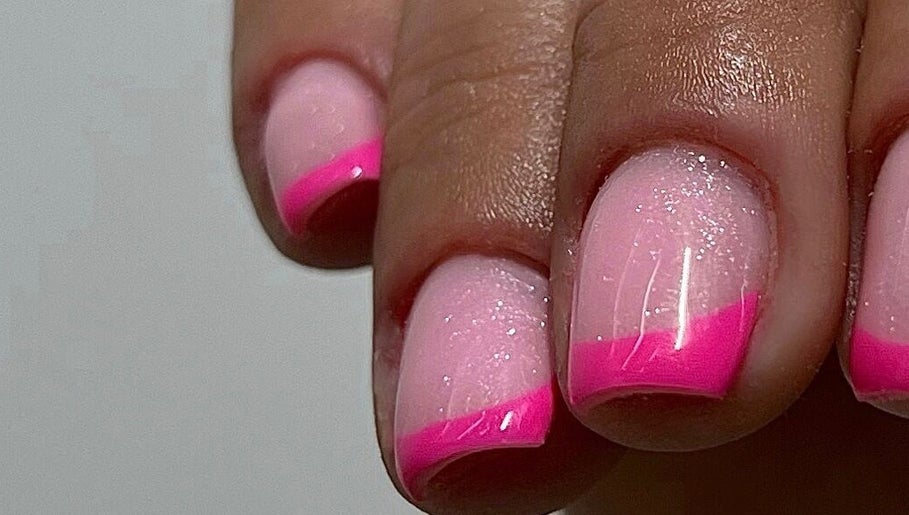 Glamorous pink French manicure at Beauty Muse (BLEND) in Skewen, Wales, GB. Perfectly polished salon nails.