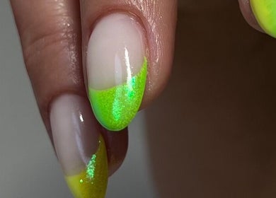 Close-up of neon green manicure at Beauty Muse (BLEND), Skewen, Wales, GB, showcasing elegant nail art.