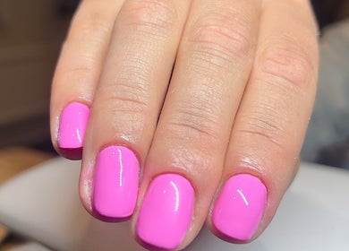 Bright pink manicured nails at Beauty Muse (BLEND) in Skewen, Wales, GB, showcasing expert nail artistry.