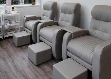 Modern manicure chairs at Laura Bell Salon, Falmouth, England, GB, offering a serene beauty experience.