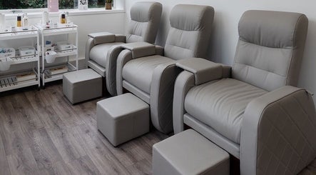 Modern manicure chairs at Laura Bell Salon, Falmouth, England, GB, offering a serene beauty experience.