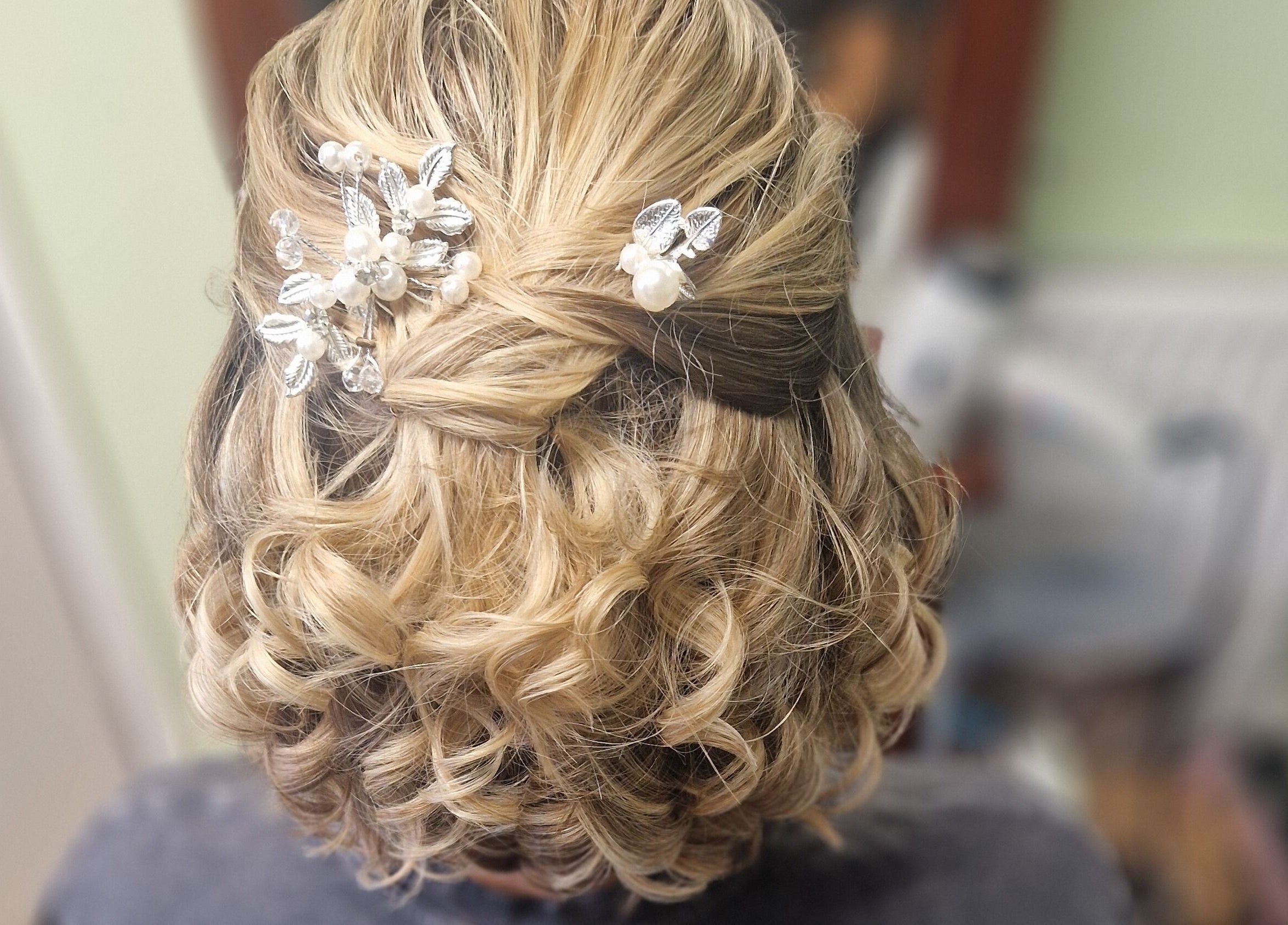 Intricate bridal hairstyle with flower accessories at Style n Smile Hair By Donna, Bruton, England, GB.