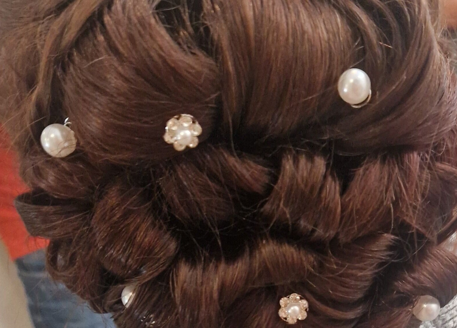 Intricate bridal updo with pearls by Style n Smile Hair By Donna, Bruton, England, GB.