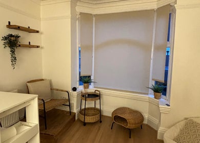 Inviting room at At One Holistic Wellbeing, Halesowen, England, GB, featuring warm decor and natural light.