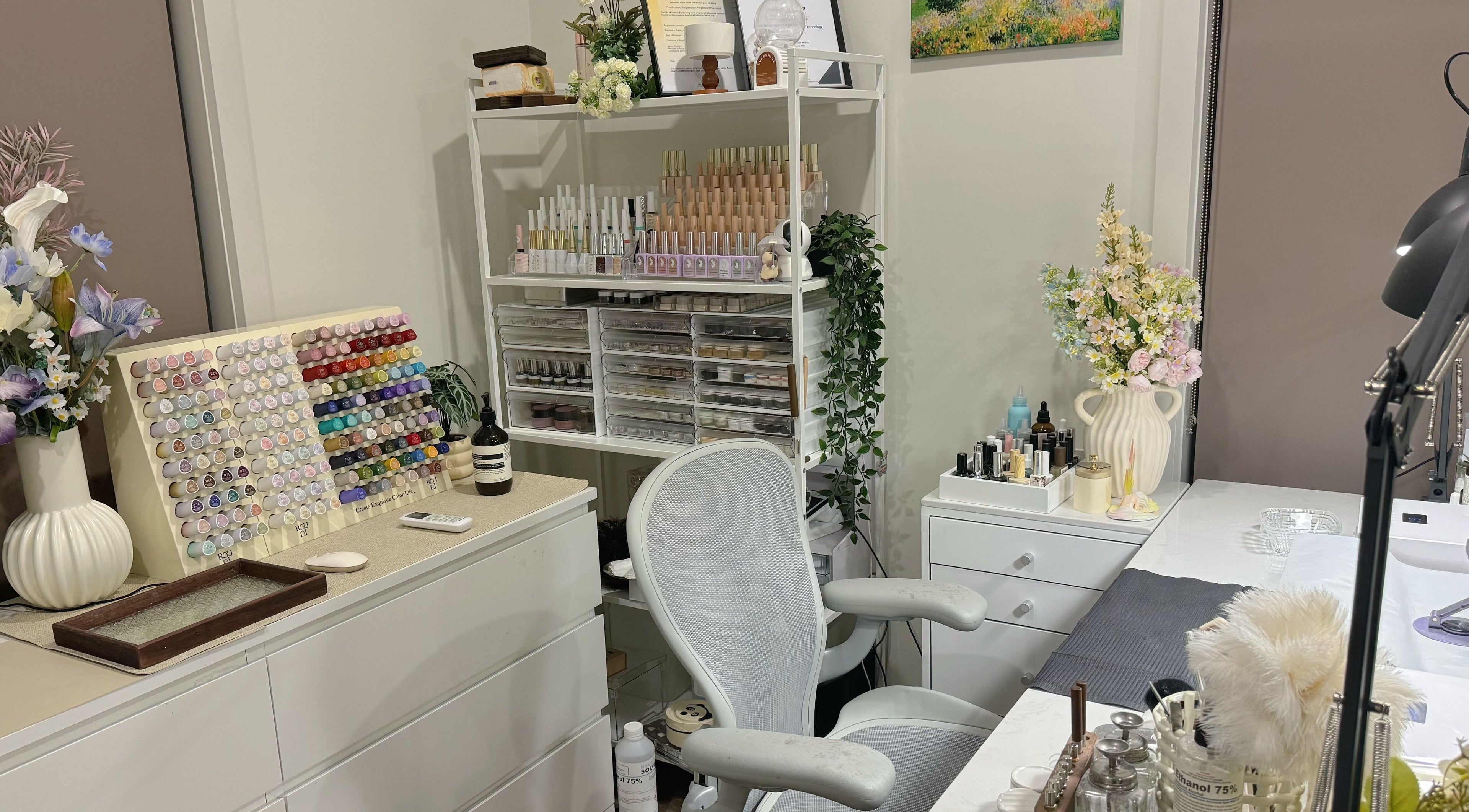 Vibrant nail polish display at Pixie Nail Art, Melbourne, Victoria, AU, showcasing a chic and inviting workspace.