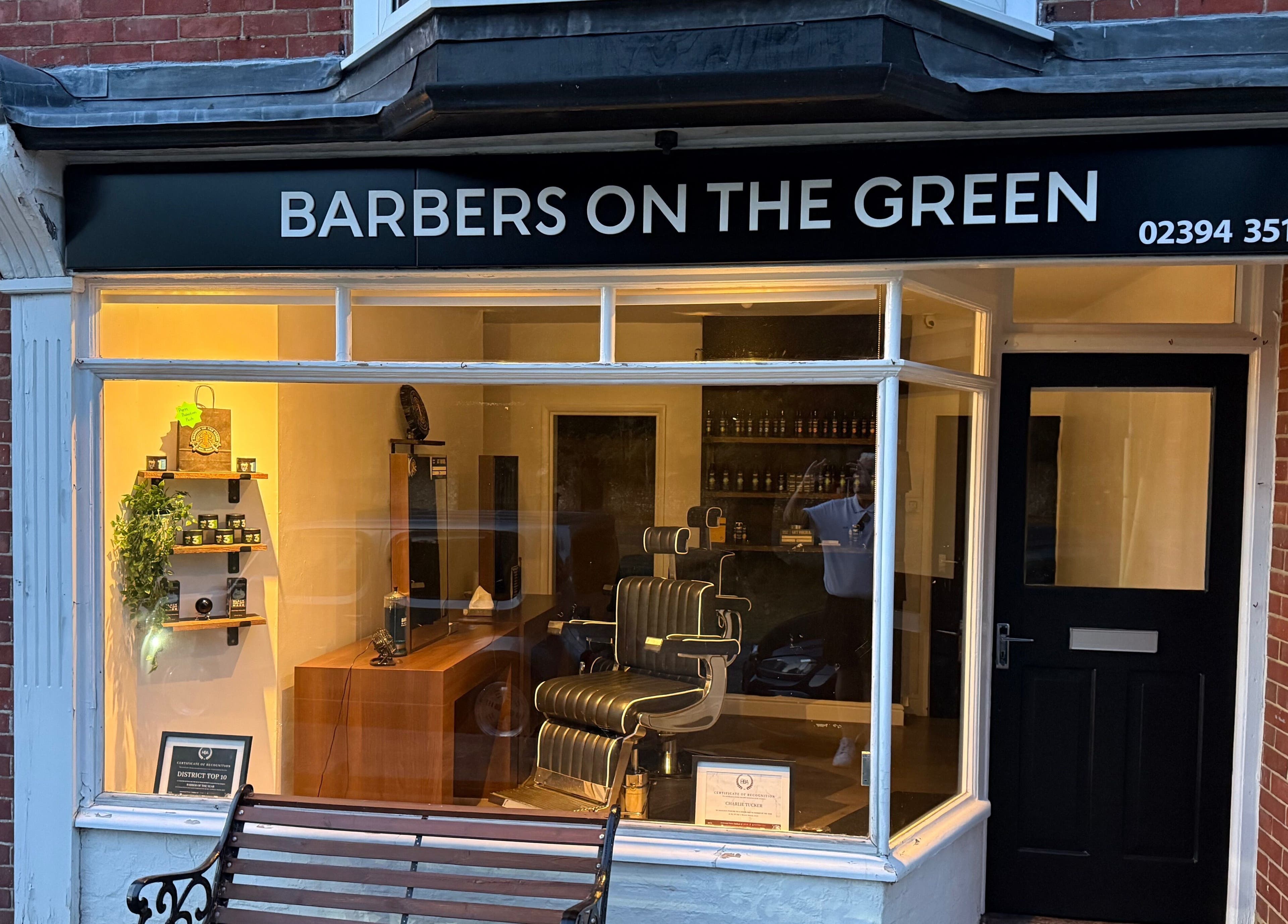 Exterior of Barbers on the Green Rowlands Castle, stylish shopfront in Rowlands Castle, England, GB.