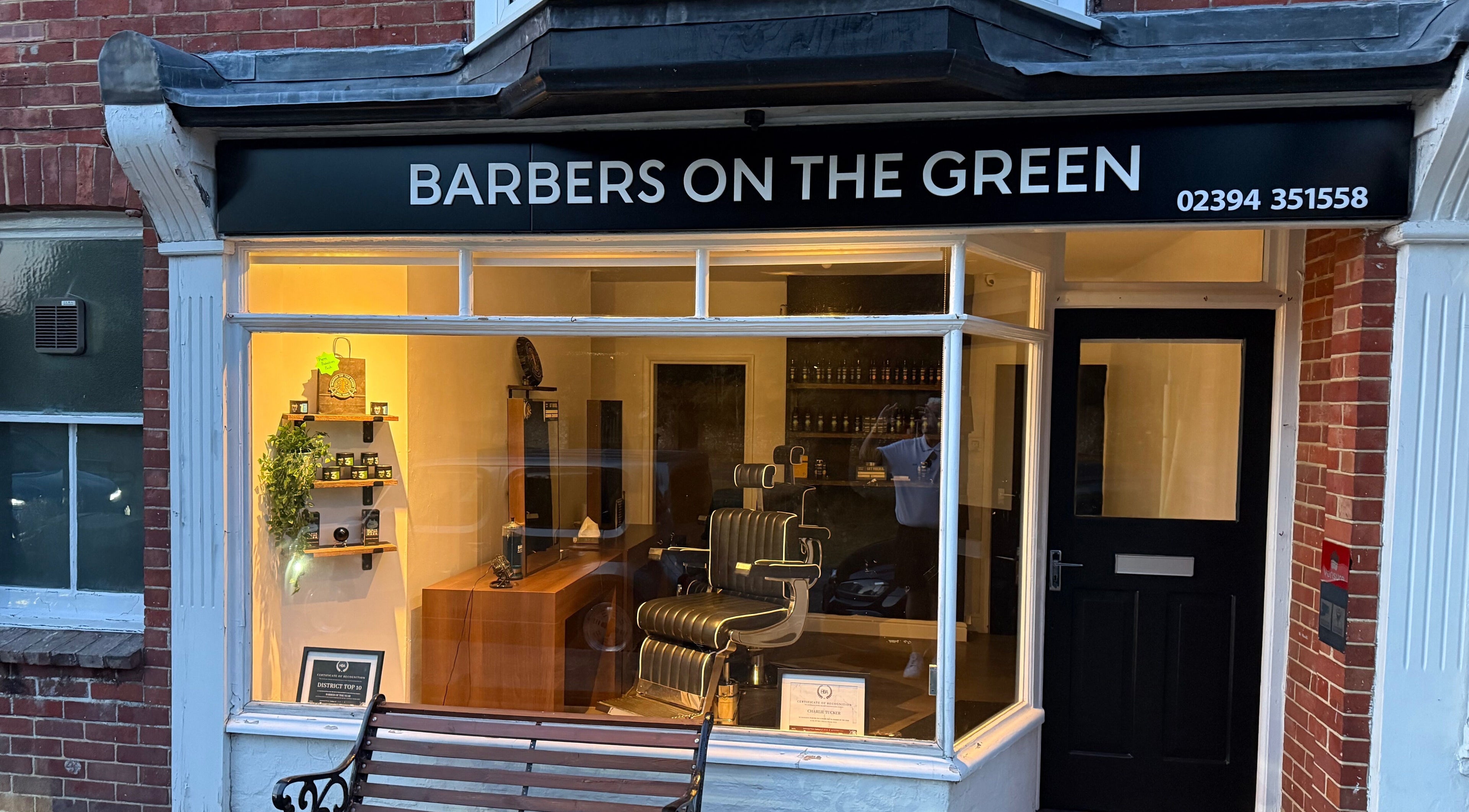 Exterior of Barbers on the Green Rowlands Castle, stylish shopfront in Rowlands Castle, England, GB.