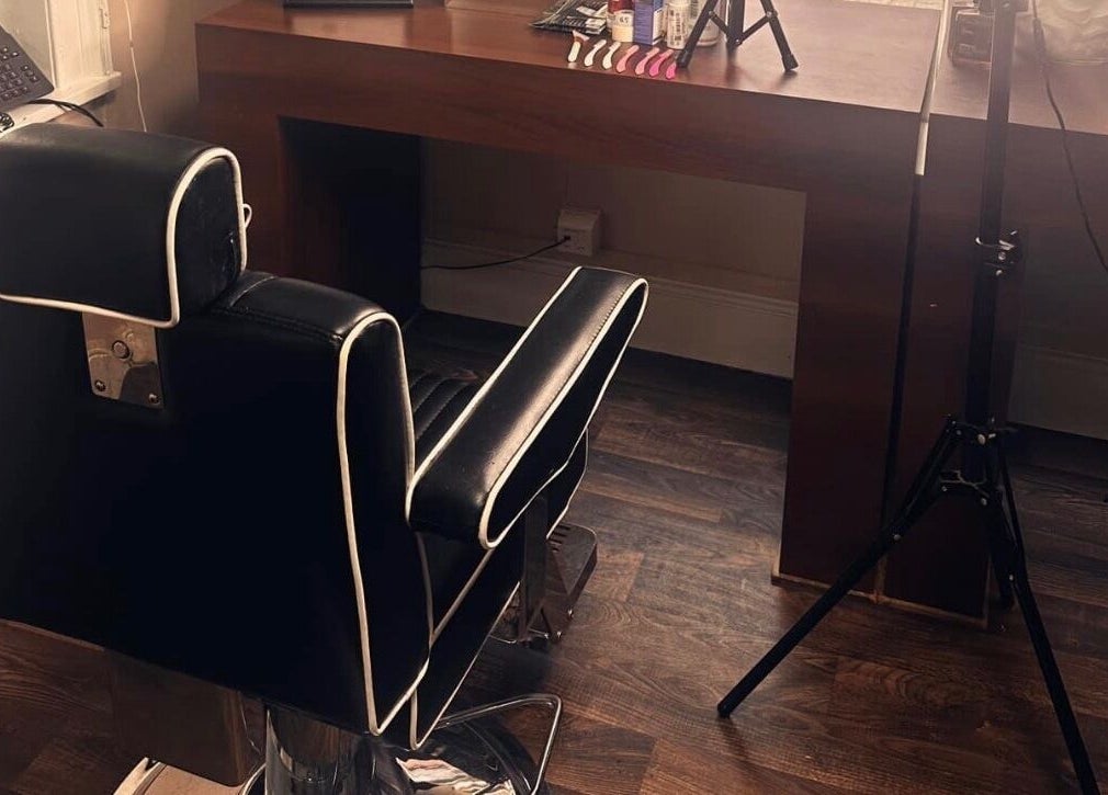 Modern barber chair at Barbers on the Green Rowlands Castle, Rowlands Castle, England, GB, ready for clients.