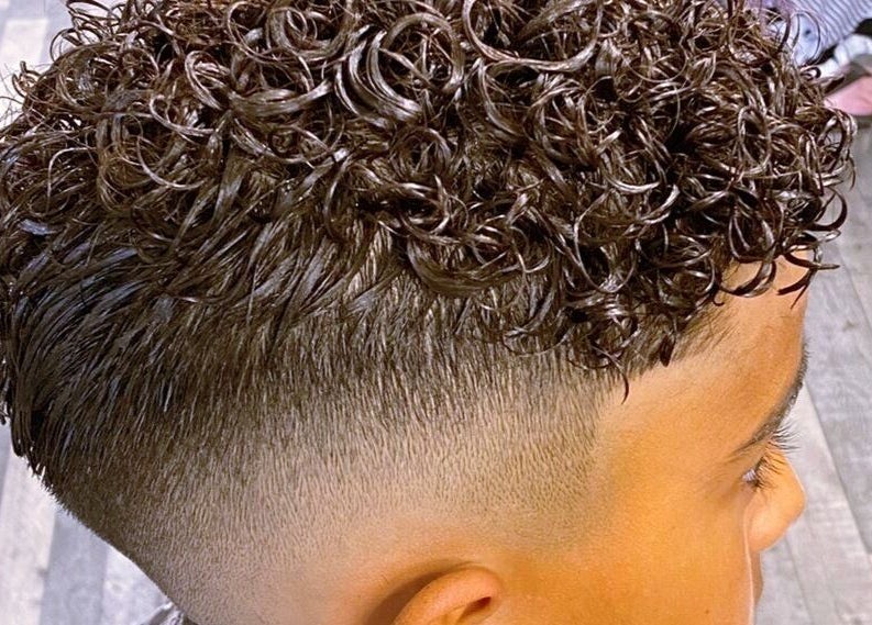 Close-up of curly hairstyle expertly crafted at Barbers On The Green Havant, Havant, England, GB.