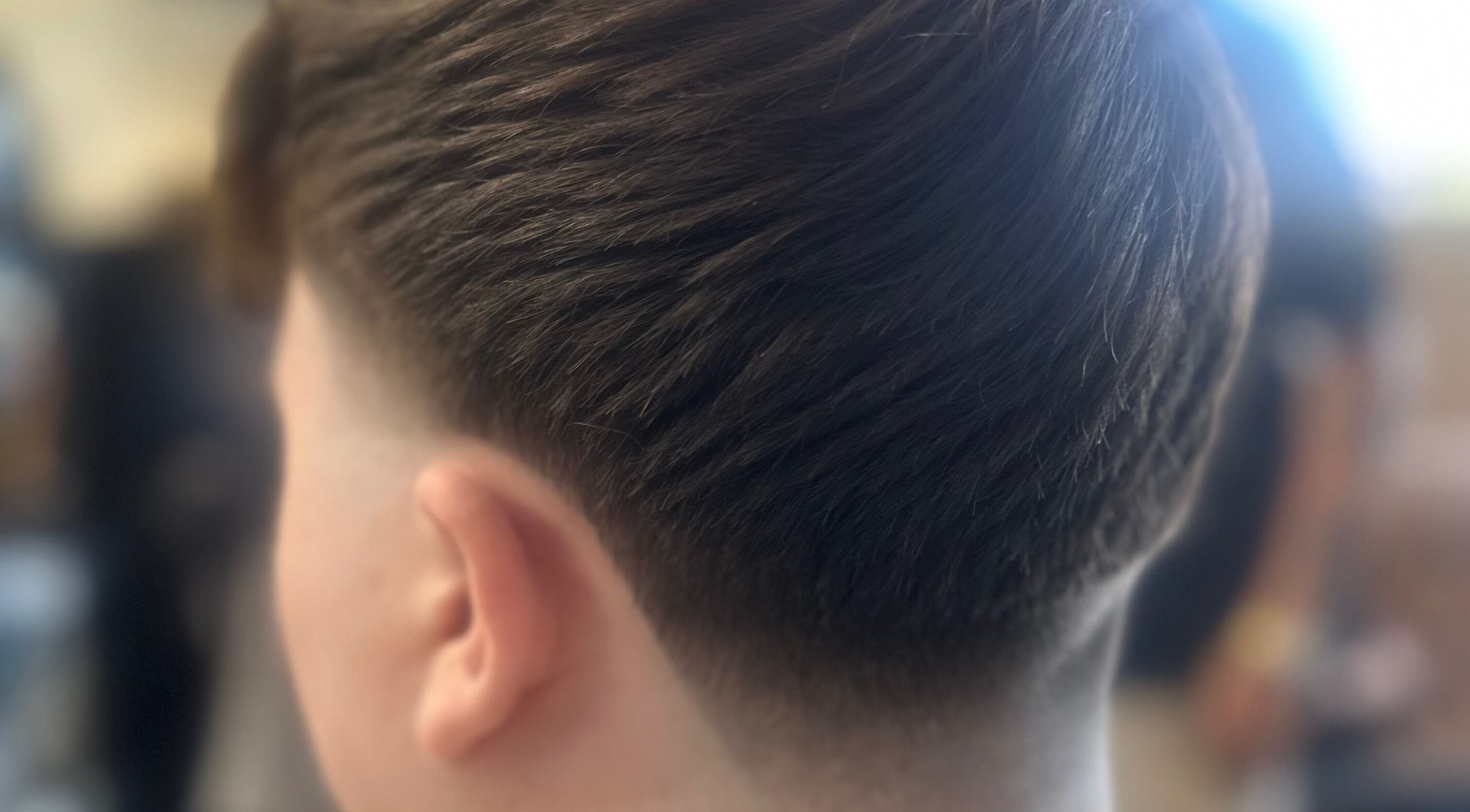 Close-up of a modern fade haircut at Barbers On The Green Havant, located in Havant, England, GB.