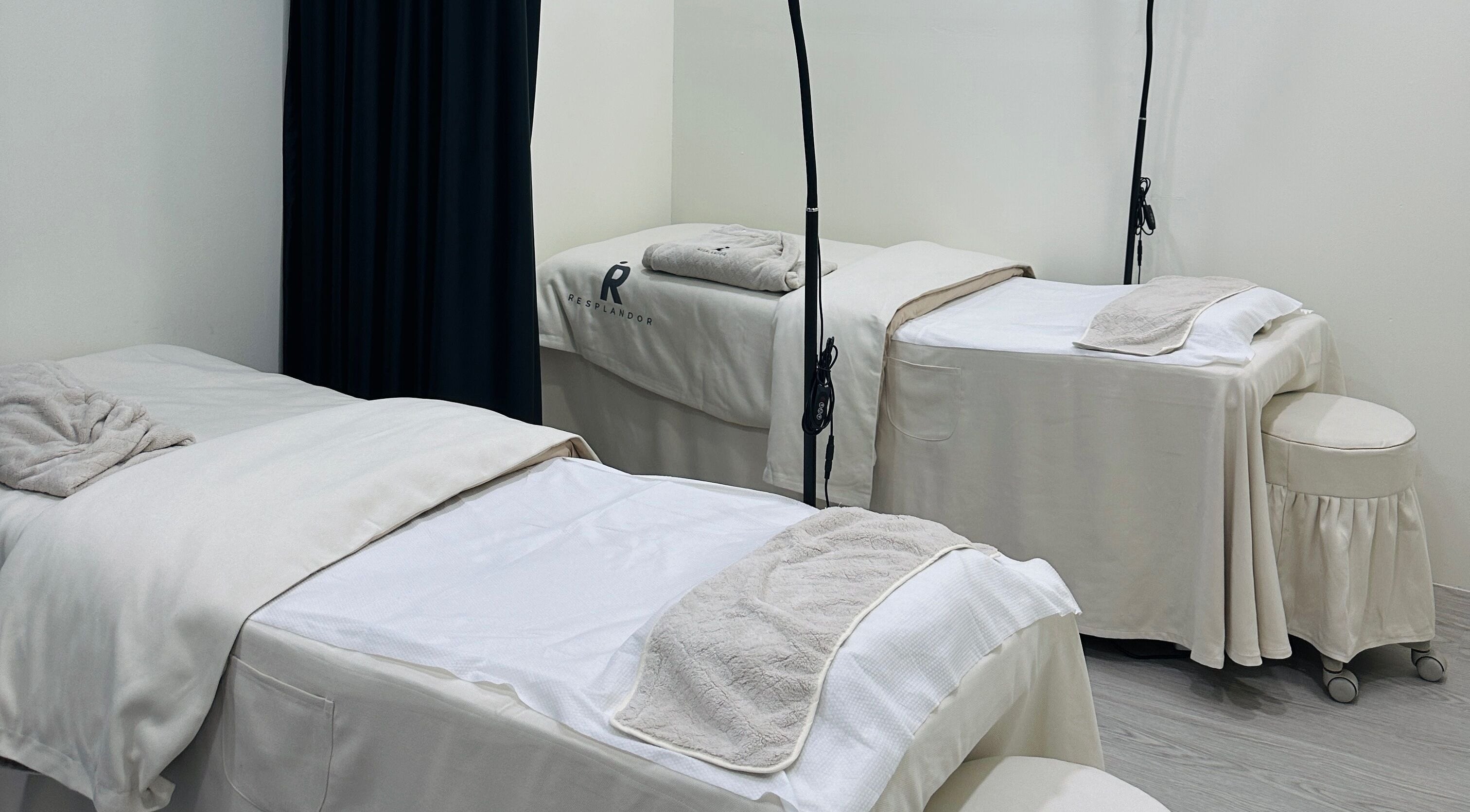 Tranquil spa beds at Real Skin SG, Singapore, SG, offering relaxation and wellness.