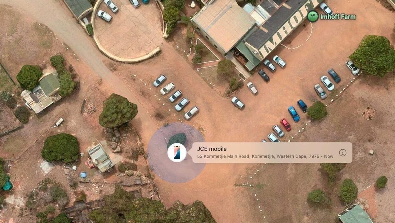 Aerial view of Ithongo's outdoor parking in Cape Town, Western Cape, ZA, featuring cars and surrounding landscape.