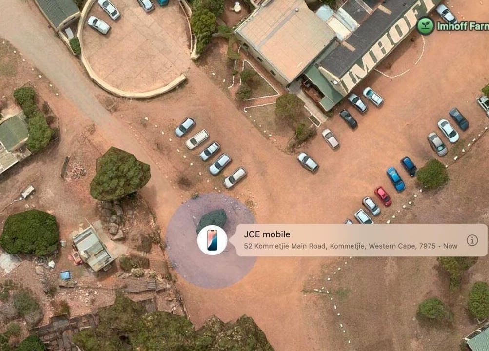 Aerial view of Ithongo's outdoor parking in Cape Town, Western Cape, ZA, featuring cars and surrounding landscape.