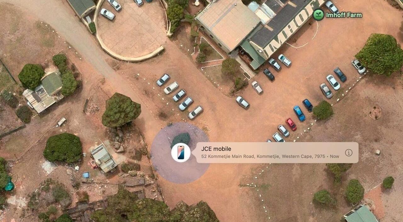 Aerial view of Ithongo's outdoor parking in Cape Town, Western Cape, ZA, featuring cars and surrounding landscape.