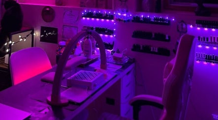 Charmed Nailzz nail studio in Red Deer, Alberta, CA, illuminated with calming purple lights for a serene vibe.