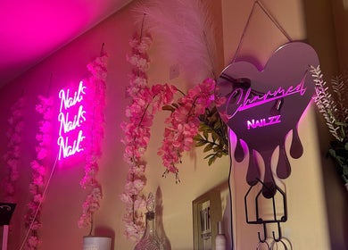 Charmed Nailzz neon sign with pink blossoms, Red Deer, Alberta, CA.
