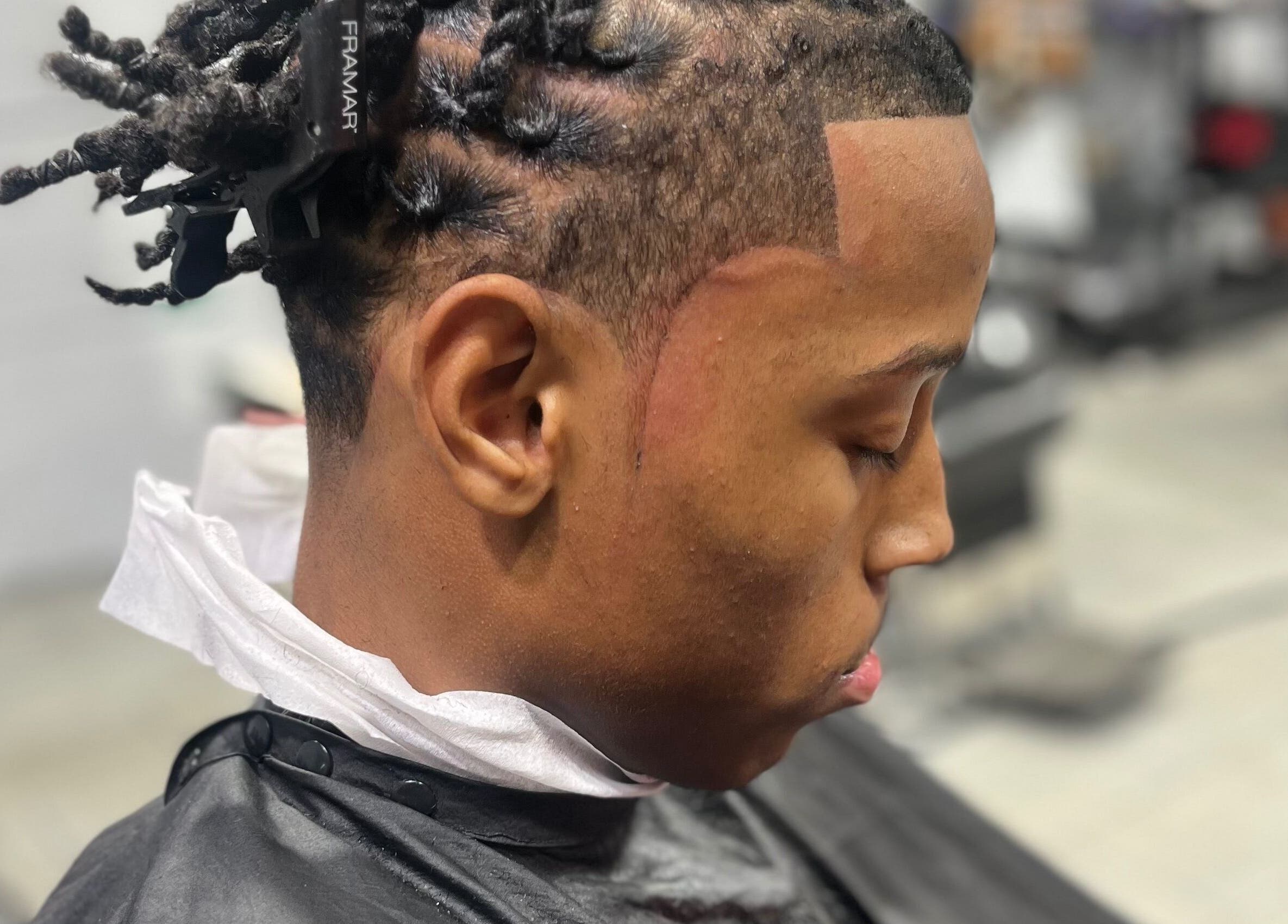 Close-up of a stylish haircut at Den Of Sauce, Lathrup, Michigan, US displaying expert grooming.