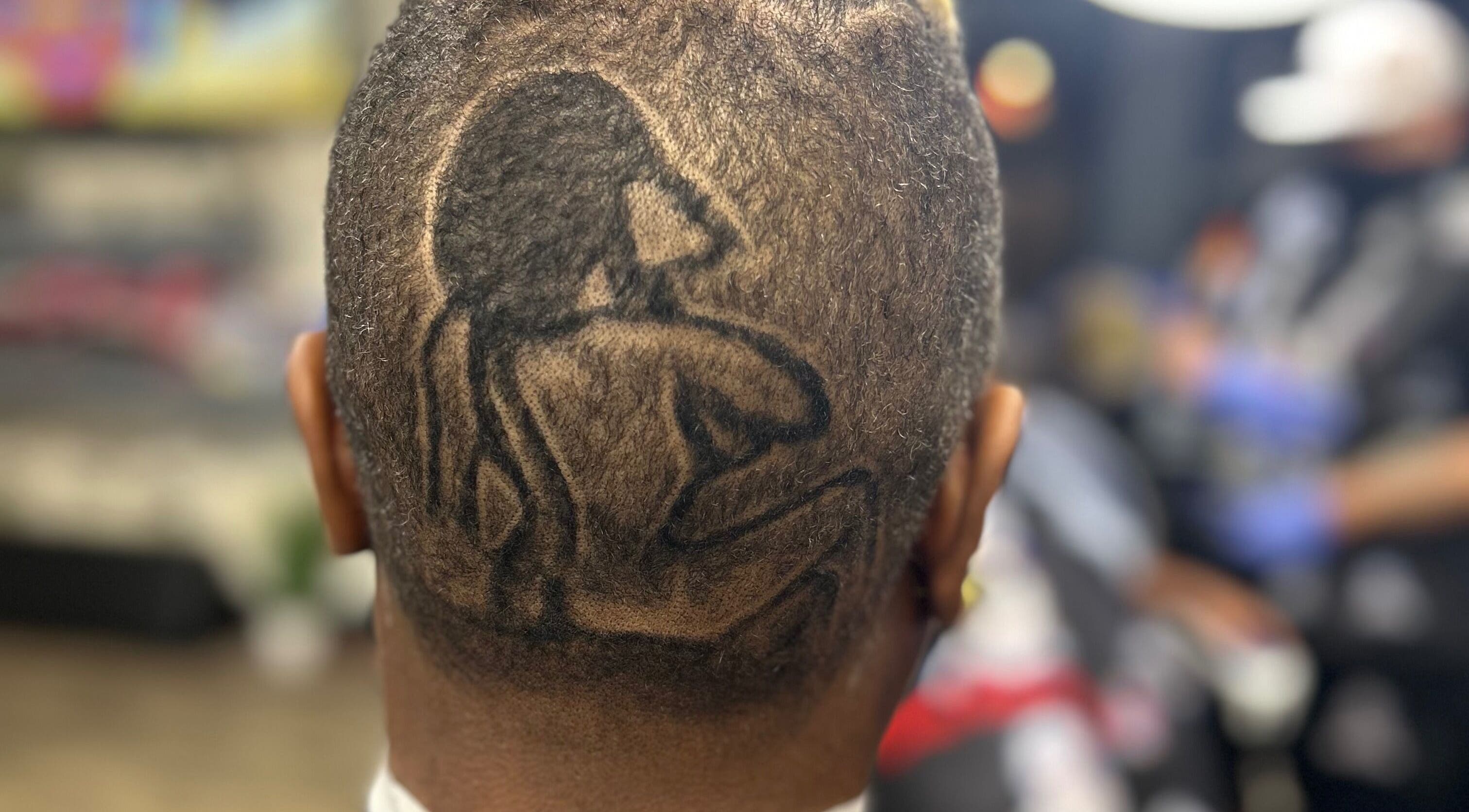 Detailed hair tattoo design at Den Of Flavor, Lathrup, Michigan, US showcasing expert artistry.