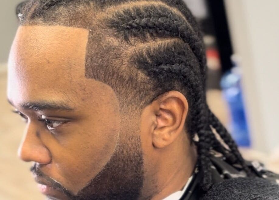 Close-up of a stylish braided hairstyle at Den Of Flavor, Lathrup, Michigan, US, showcasing expert grooming.
