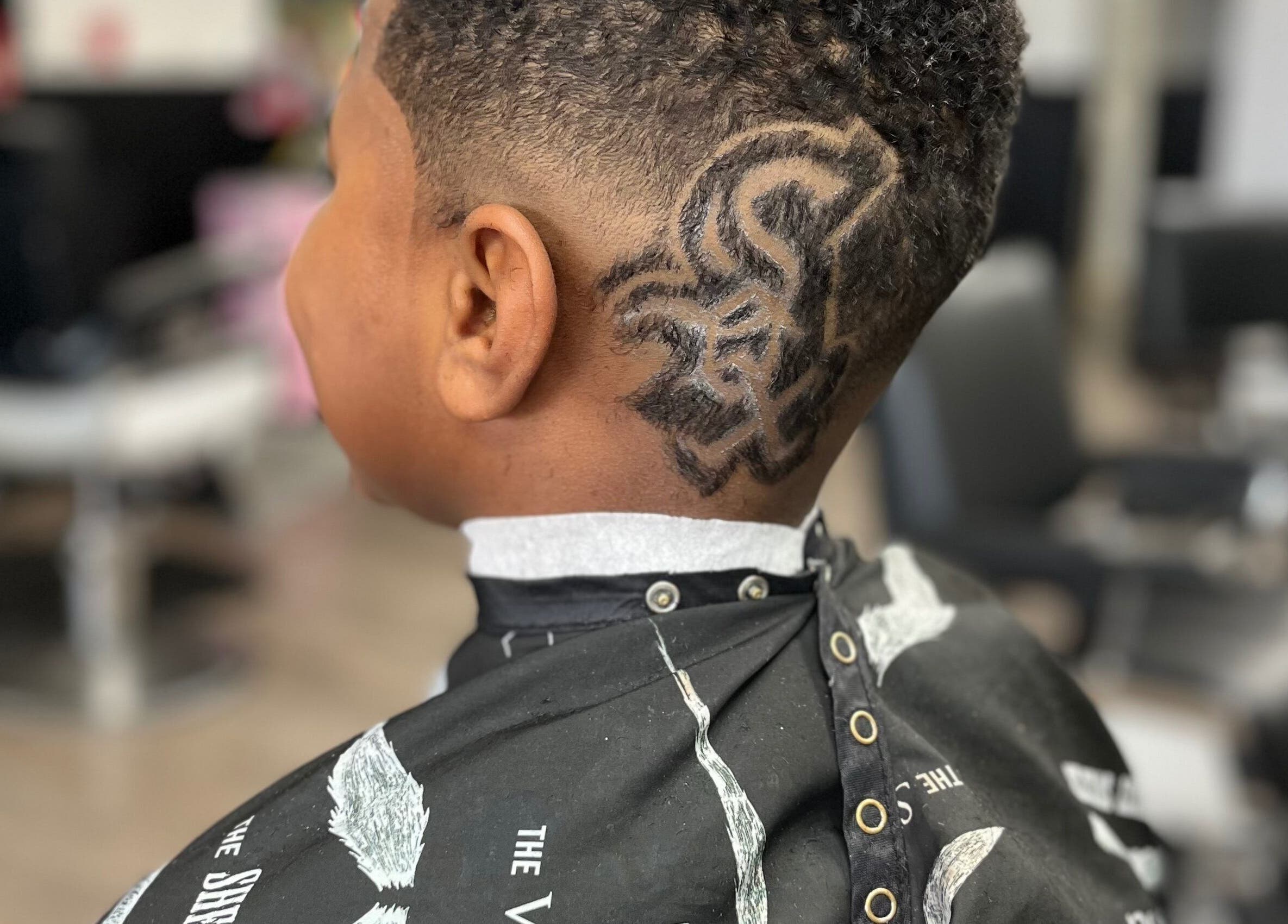 Unique hair design seen at Den Of Flavor, Lathrup, Michigan, US barber shop.