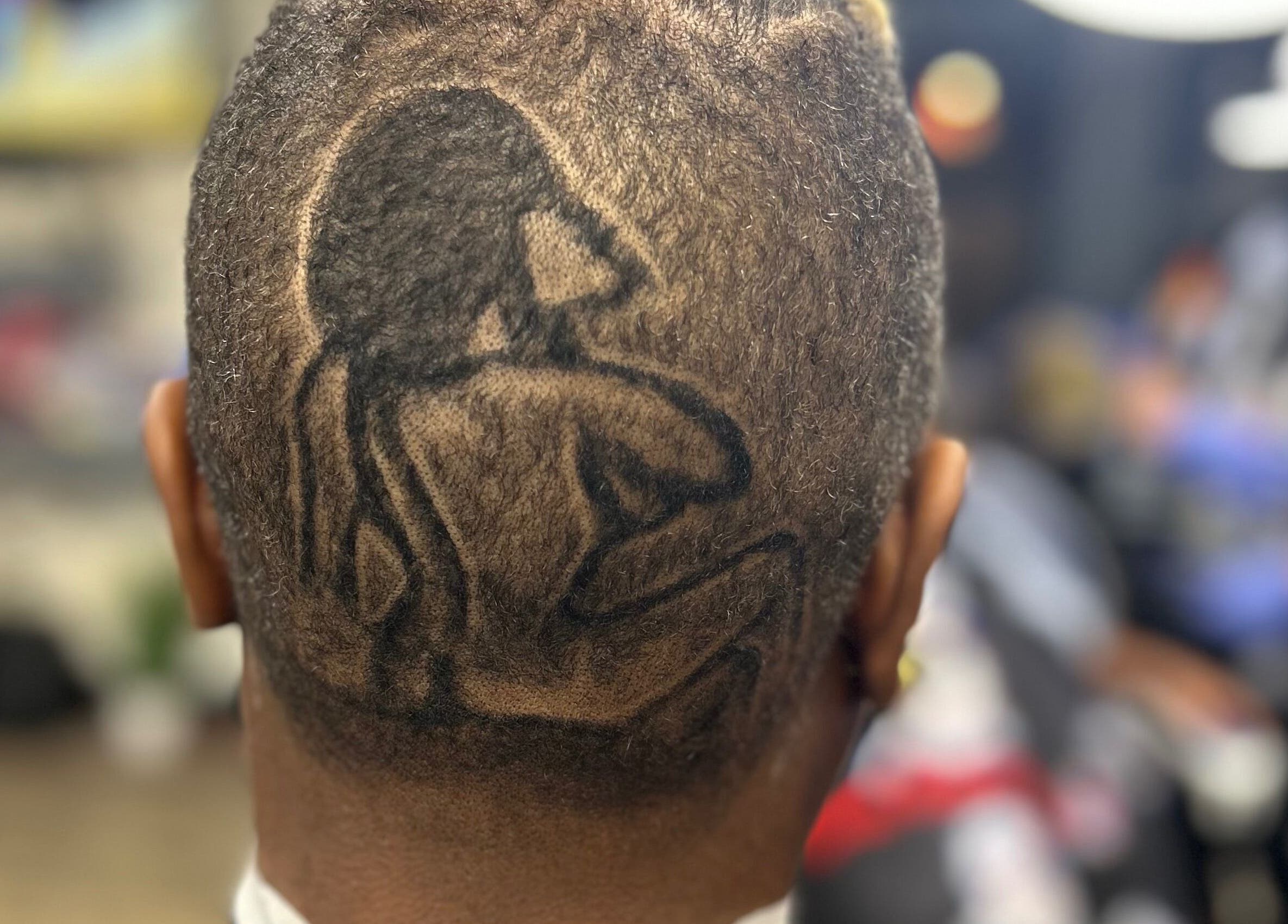 Intricate hair design at Den Of Flavor in Lathrup, Michigan, US showcases artistic flair.