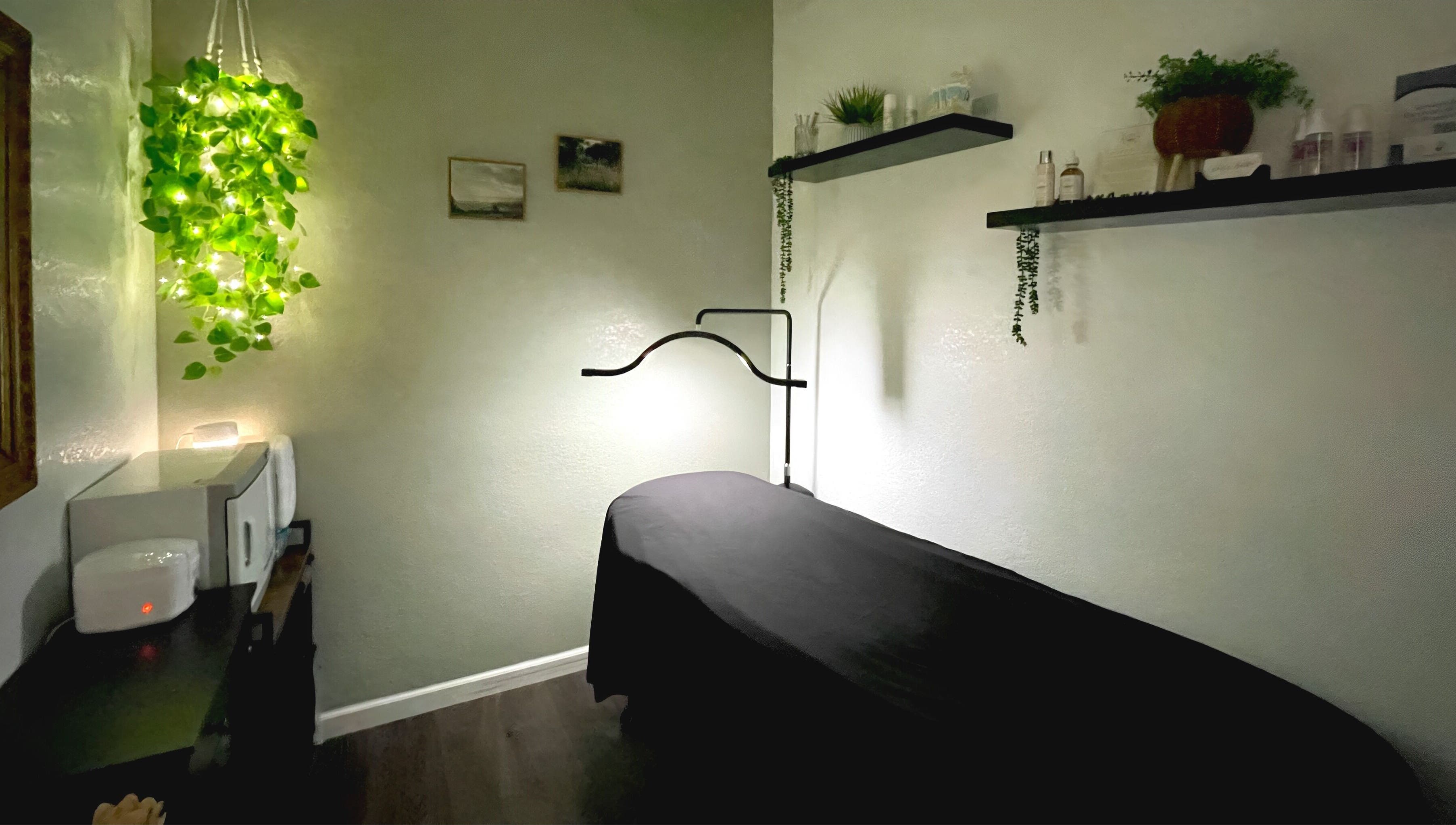 Cozy treatment room at Emily Beck Esthetics at The Upper Cut in Bryan, Ohio, US, with serene decor and soft lighting.