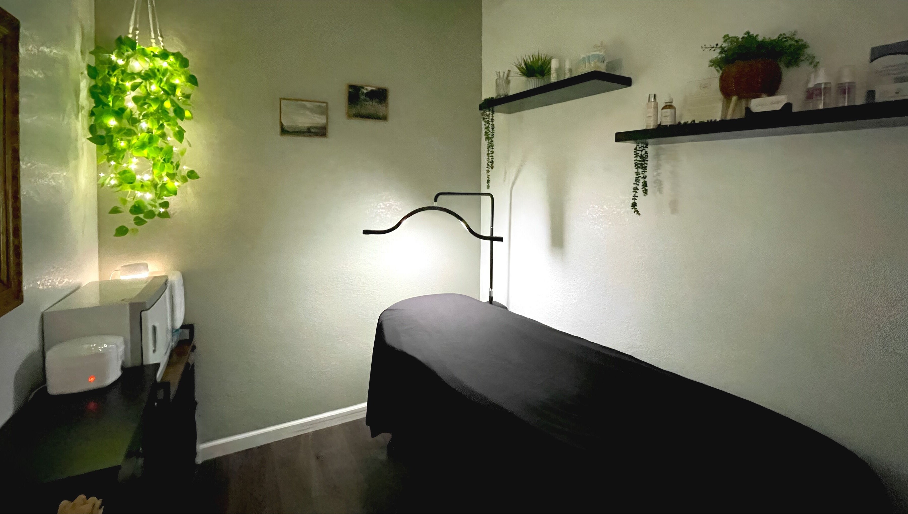 Cozy treatment room at Emily Beck Esthetics at The Upper Cut in Bryan, Ohio, US, with serene decor and soft lighting.