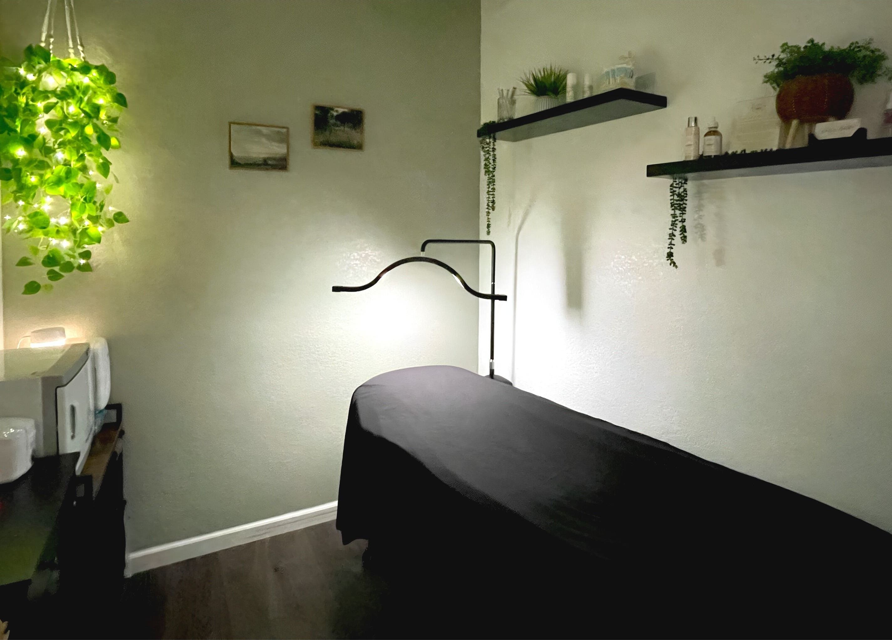 Cozy treatment room at Emily Beck Esthetics at The Upper Cut in Bryan, Ohio, US, with serene decor and soft lighting.