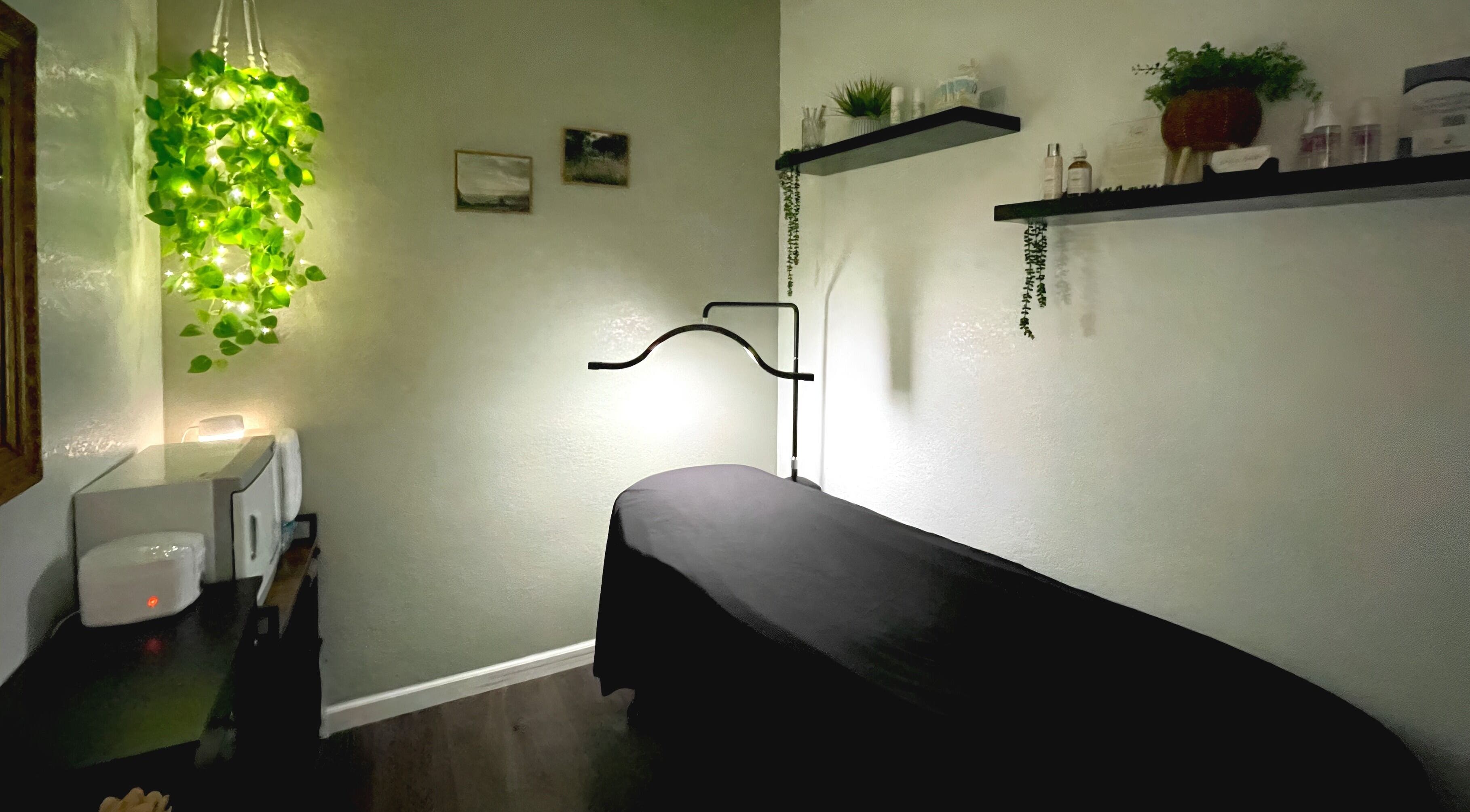 Cozy treatment room at Emily Beck Esthetics at The Upper Cut in Bryan, Ohio, US, with serene decor and soft lighting.