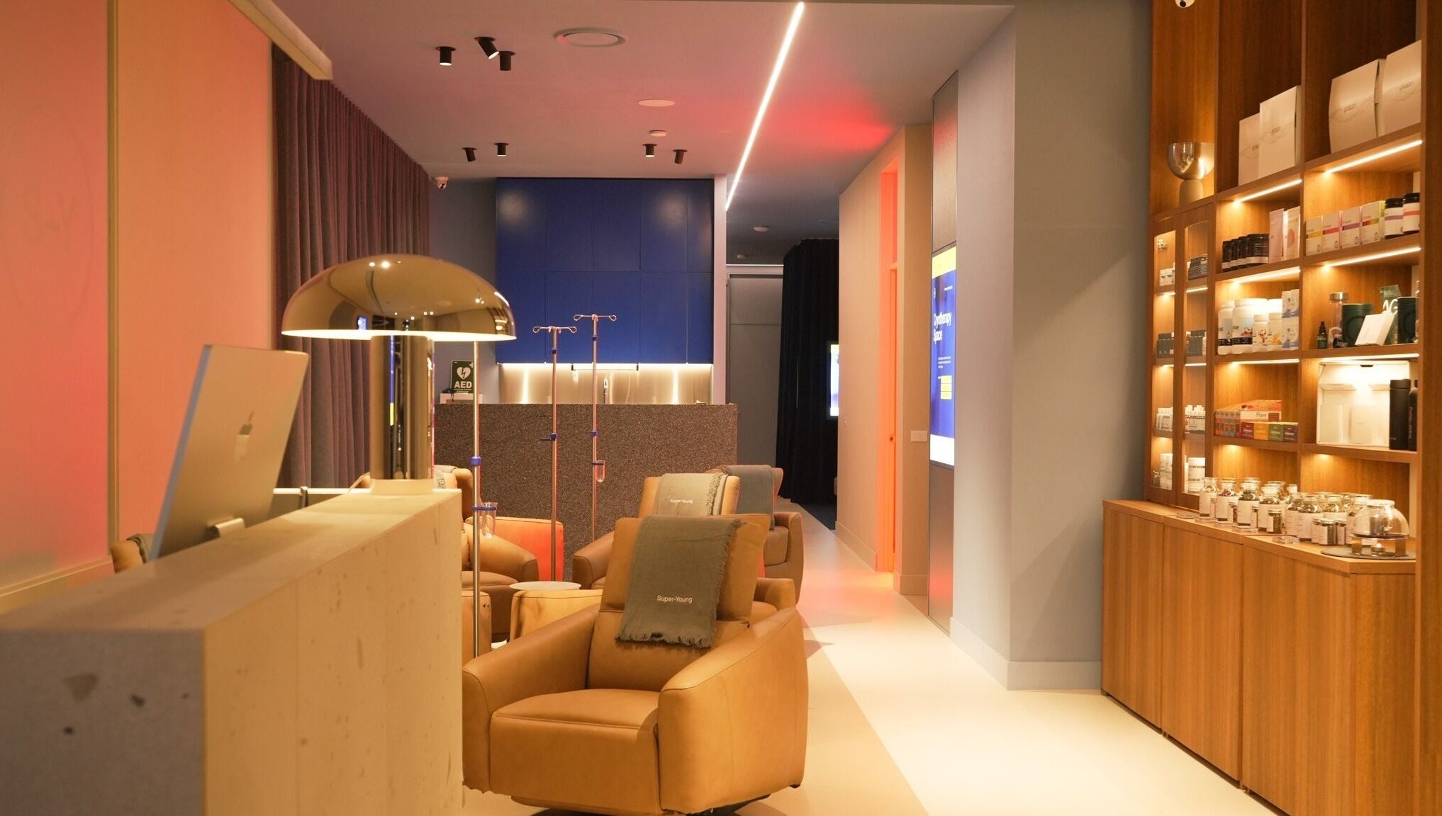 Elegant interior of Super-Young in Armadale, Victoria, AU, showcasing chic seating and ambient lighting.