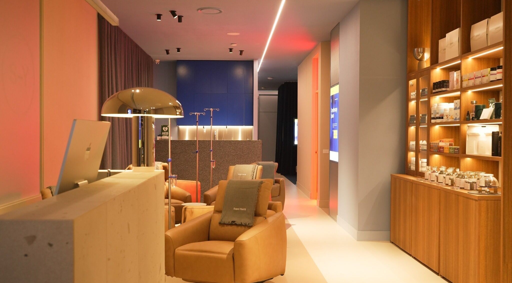 Elegant interior of Super-Young in Armadale, Victoria, AU, showcasing chic seating and ambient lighting.