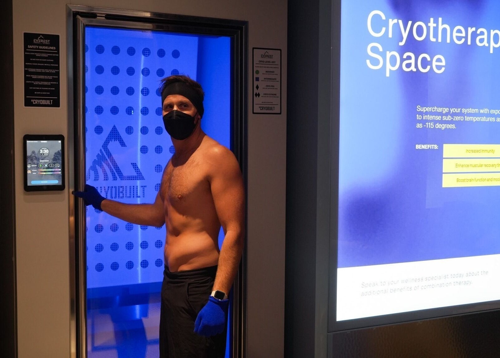 Cryotherapy chamber in Super-Young, Armadale, Victoria, AU with person preparing for session.