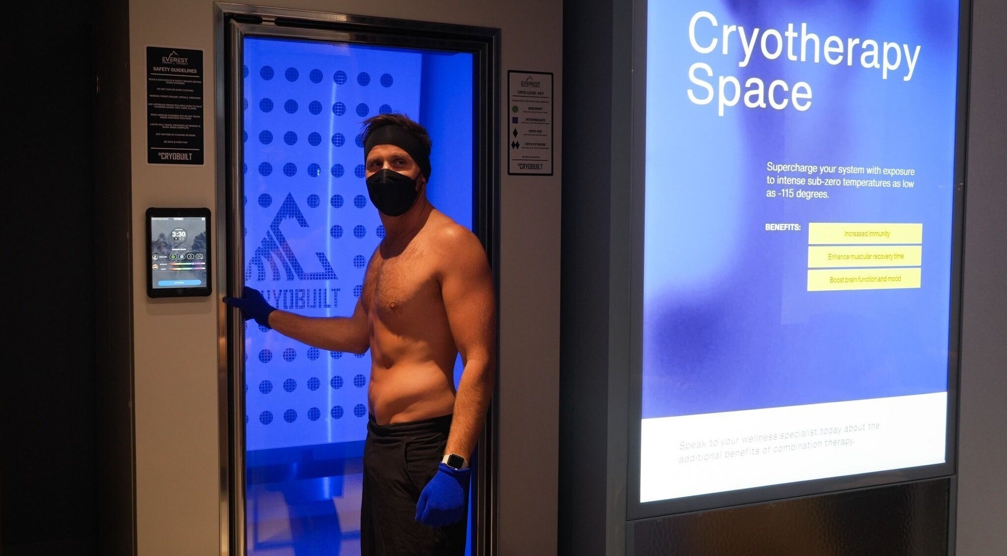 Cryotherapy chamber in Super-Young, Armadale, Victoria, AU with person preparing for session.