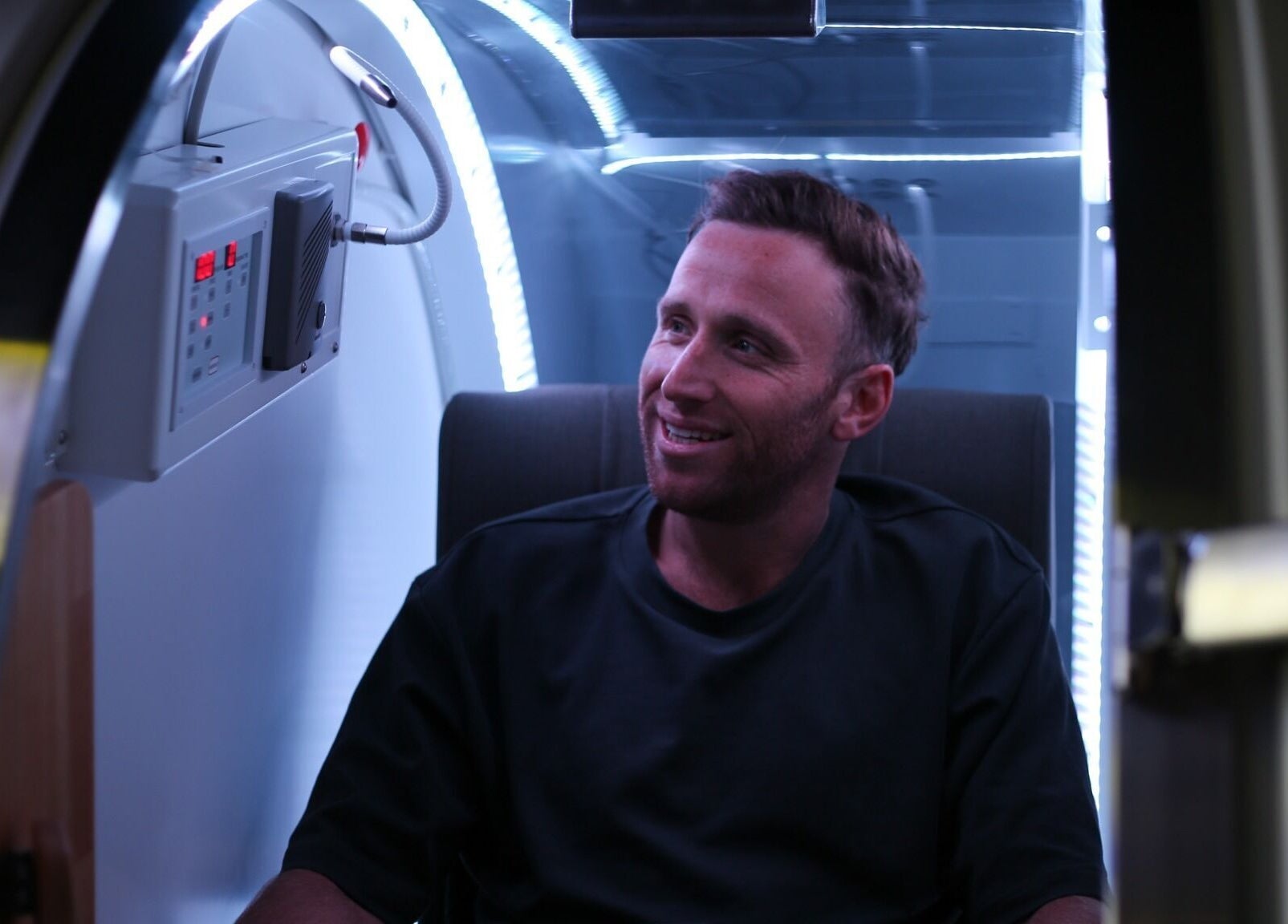 A man enjoying a wellness capsule session at Super-Young, Armadale, Victoria, AU.