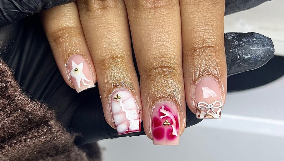 Intricate nail art design at Nailzbycharl, Swansea, Wales, GB showcasing unique manicure styles.