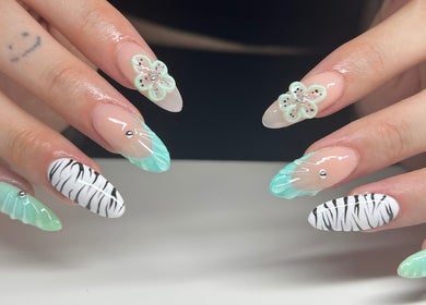 Stylish mint and zebra nails design at Nailzbycharl, Swansea, Wales, GB.
