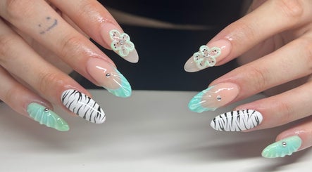 Stylish mint and zebra nails design at Nailzbycharl, Swansea, Wales, GB.