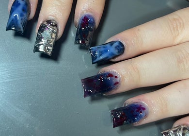 Artistic nail design at Nailzbycharl, Swansea, Wales, GB featuring cosmic patterns and metallic accents.