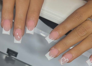French manicure with a heart at Nailzbycharl, Swansea, Wales, GB. Perfectly styled nails for a chic look.