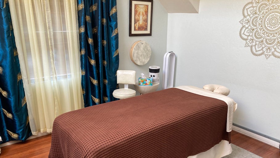 Tranquil massage room at Dana Jayne, Cmt in Oakland, California, US featuring elegant decor and a cozy massage bed.