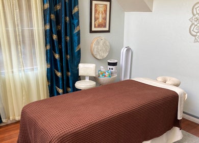 Tranquil massage room at Dana Jayne, Cmt in Oakland, California, US featuring elegant decor and a cozy massage bed.