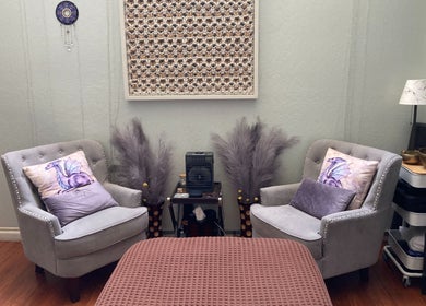 Relaxing seating area at Dana Jayne, Cmt in Oakland, California, US with plush chairs and calming decor.