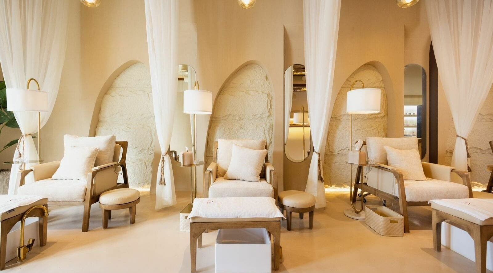 Relaxing lounge at Lou Beauty Lounge, Riyadh, Riyadh Province, SA with soft seating and ambient lighting.