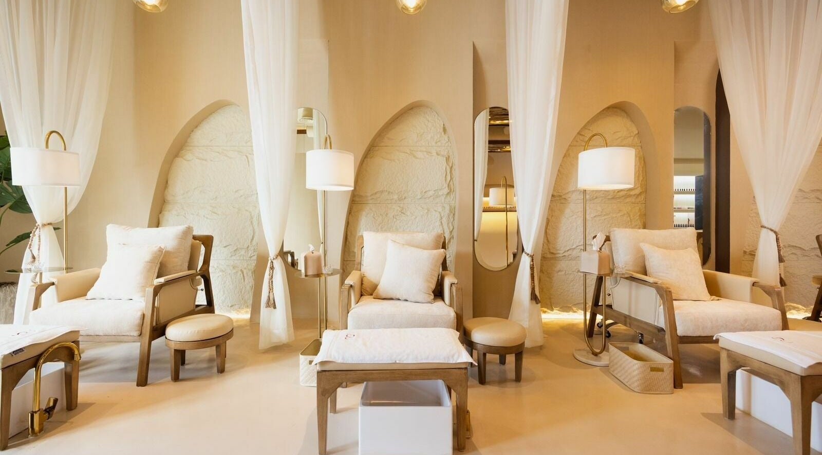 Relaxing lounge at Lou Beauty Lounge, Riyadh, Riyadh Province, SA with soft seating and ambient lighting.